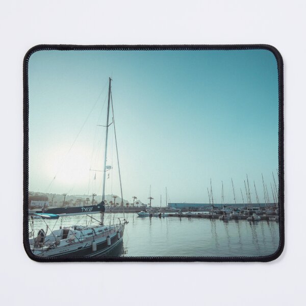 Item preview, Sailing yachts docked in a calm harbor under a bright, turquoise sky. designed and sold by MDB_Shop.