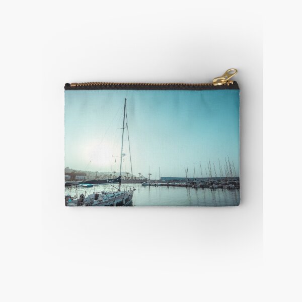 Item preview, Sailing yachts docked in a calm harbor under a bright, turquoise sky. designed and sold by MDB_Shop.