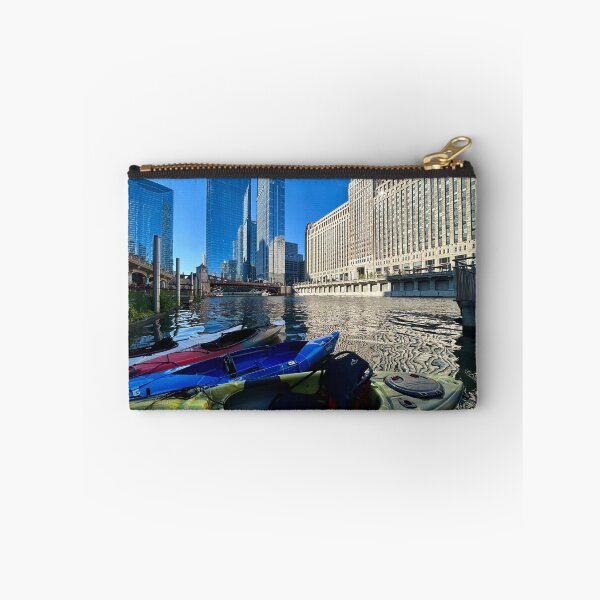 Item preview, Canoe beyond Merchandise Mart on Chicago River designed and sold by vasi imagery.