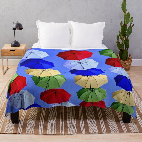 Item preview, Colorful umbrella sky – Cheerful scene under a blue sky / Swiss Artwork Photography designed and sold by Raphael Wolf.