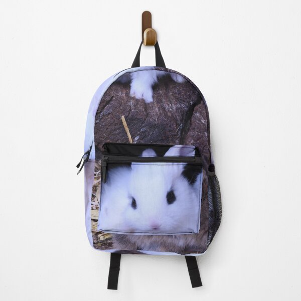 Item preview, Baby bunnies in a tree trunk – The ultimate cute scene / Swiss Artwork Photography designed and sold by Raphael Wolf.