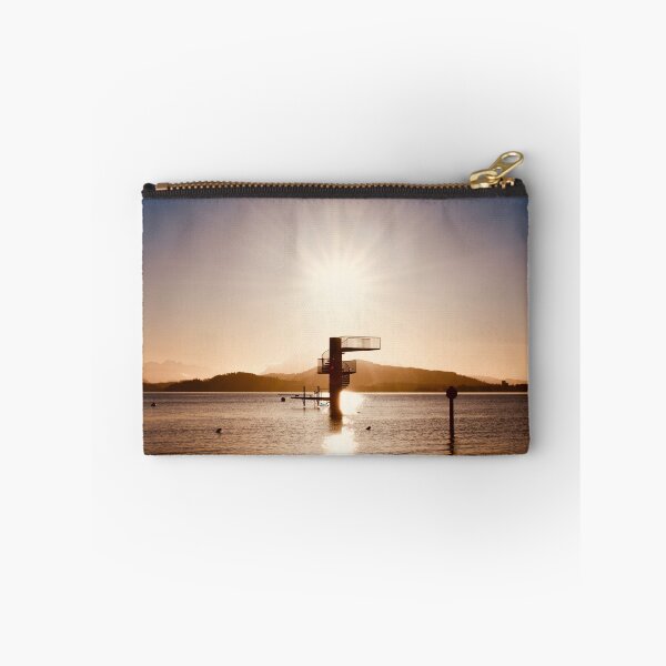 Item preview, Diving platform in the lake – Swiss mountain silhouette in warm colors / Swiss Artwork Photography designed and sold by Raphael Wolf.