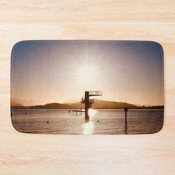 Item preview, Diving platform in the lake – Swiss mountain silhouette in warm colors / Swiss Artwork Photography designed and sold by Raphael Wolf.