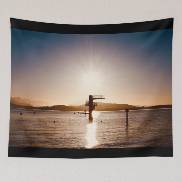 Item preview, Diving platform in the lake – Swiss mountain silhouette in warm colors / Swiss Artwork Photography designed and sold by Raphael Wolf.