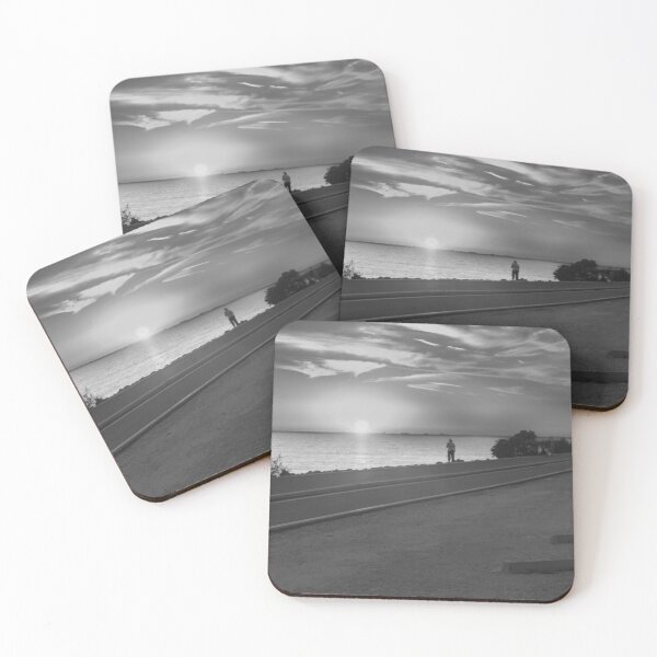Item preview, This photo captures a powerful silhouette of a person exercising along the Howard Frankland Bridge during a vibrant sunset. designed and sold by EyezWatchin.