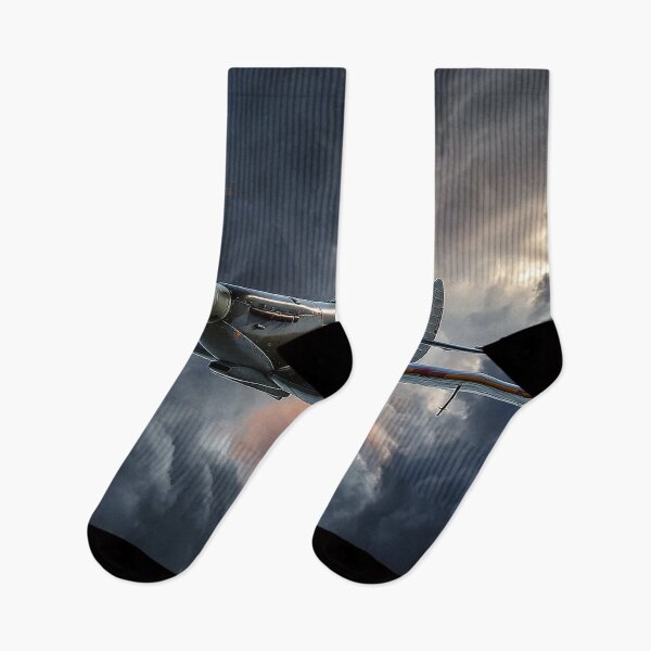 Item preview, Supermarine Spitfire Soaring Through Low Clouds Above the Countryside designed and sold by Skyframe Aviation.