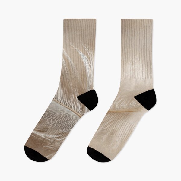 Item preview, Soft feather resting on a surface designed and sold by anytka.