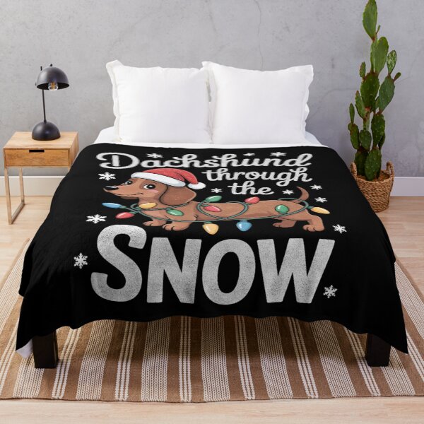 Aperçu de l'œuvre Teckel dans la neige - Joli motif de Noël créée et vendue par FreshVibe Prints.