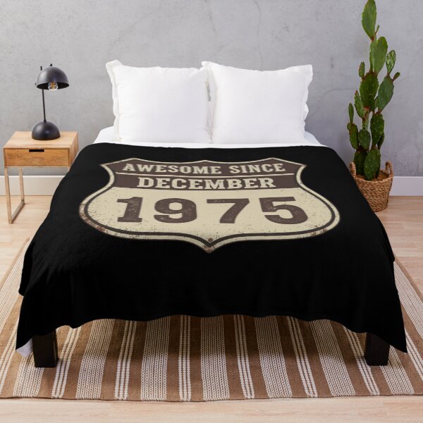 Item preview, Awesome Since December 1975 T-Shirt, vintage Route 66 birthday gift, rustic 50th birthday graphic tee, distressed retro shield tee designed and sold by Kukiishop.