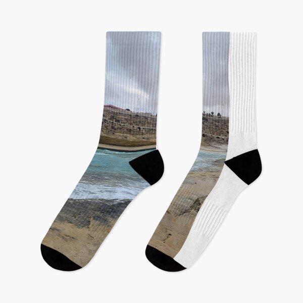 Item preview, Turquoise Shoreline Under Dramatic Coastal Cliffs & Cloudy Sky designed and sold by Torizo.