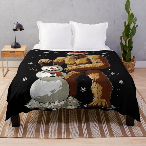 Item preview, Bigfoot Building Snowman Sasquatch Christmas Funny Holiday Graphic designed and sold by Taniyah Gomes.