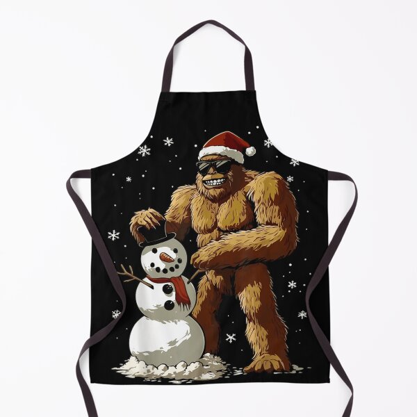 Item preview, Bigfoot Building Snowman Sasquatch Christmas Funny Holiday Graphic designed and sold by Taniyah Gomes.