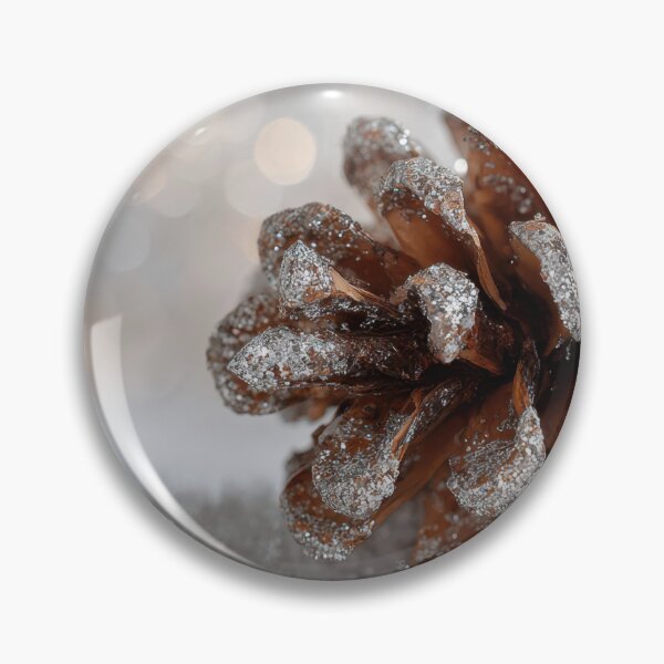 Item preview, Snow covers pine cone on ground designed and sold by anytka.