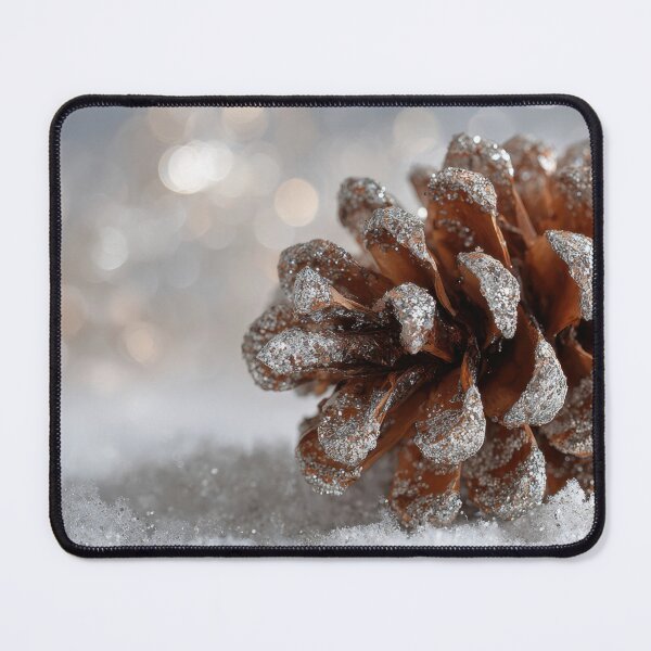 Item preview, Snow covers pine cone on ground designed and sold by anytka.