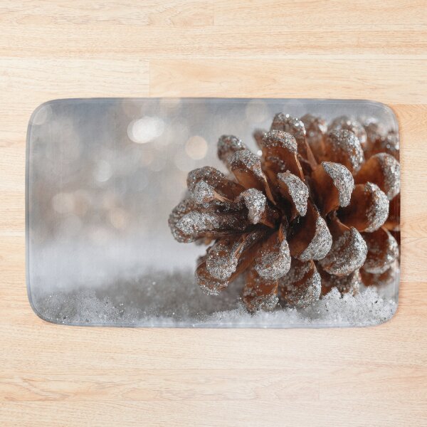 Item preview, Snow covers pine cone on ground designed and sold by anytka.