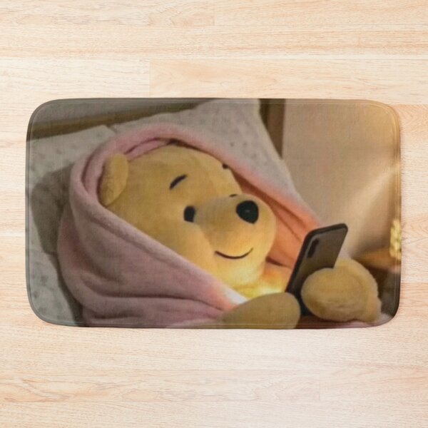 Item preview, Winnie the Pooh lying down looking at his cell phone designed and sold by MARTBOMM.