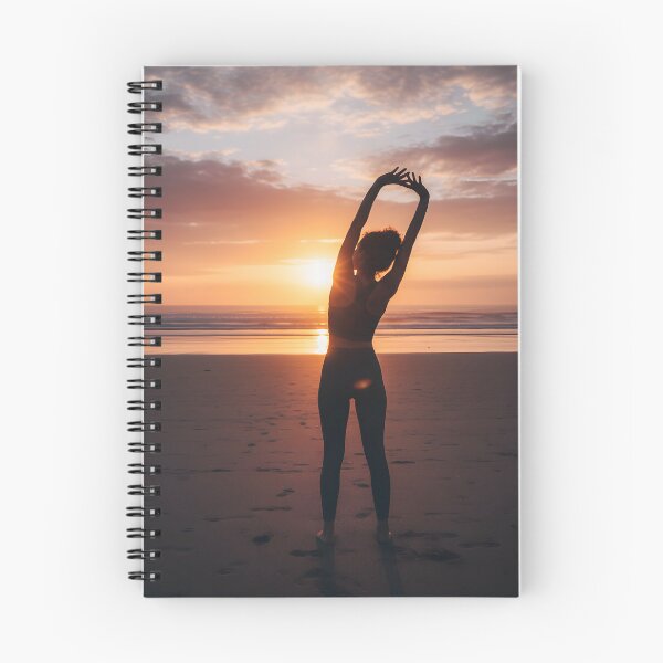 Item preview, Woman stretching arms overhead at sunset beach designed and sold by homydesign.