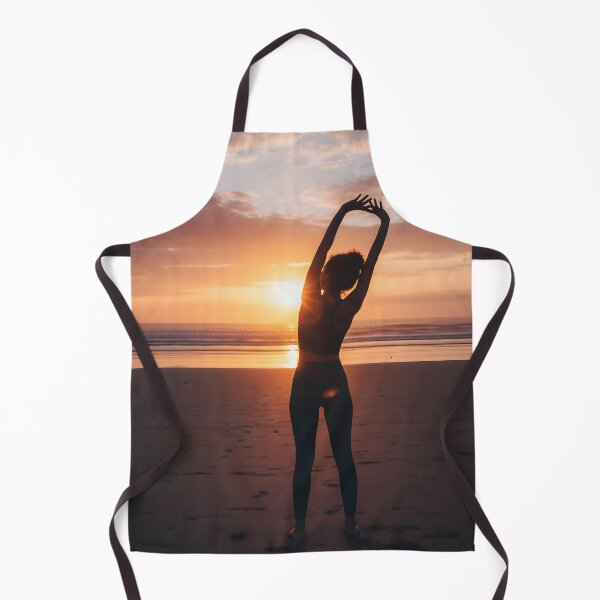 Item preview, Woman stretching arms overhead at sunset beach designed and sold by homydesign.