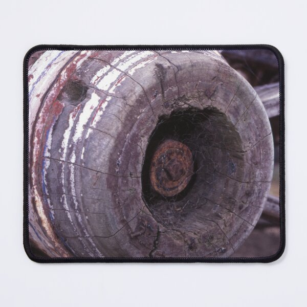 Item preview, Cobwebbed Hub: Weathered Wooden Cart Wheel Close-Up designed and sold by AnalogDays.