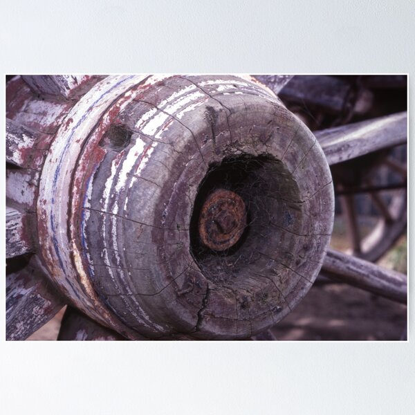 Item preview, Cobwebbed Hub: Weathered Wooden Cart Wheel Close-Up designed and sold by AnalogDays.