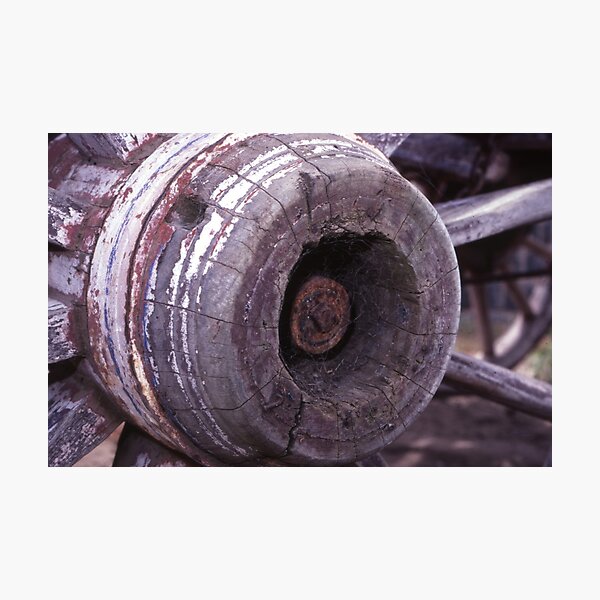 Item preview, Cobwebbed Hub: Weathered Wooden Cart Wheel Close-Up designed and sold by AnalogDays.