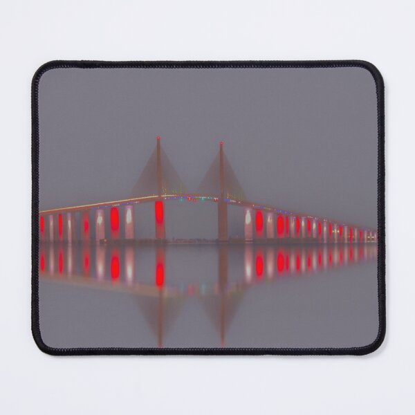 Item preview, The Sunshine Skyway Bridge glows at night illuminated with vibrant colorful lights designed and sold by EyezWatchin.