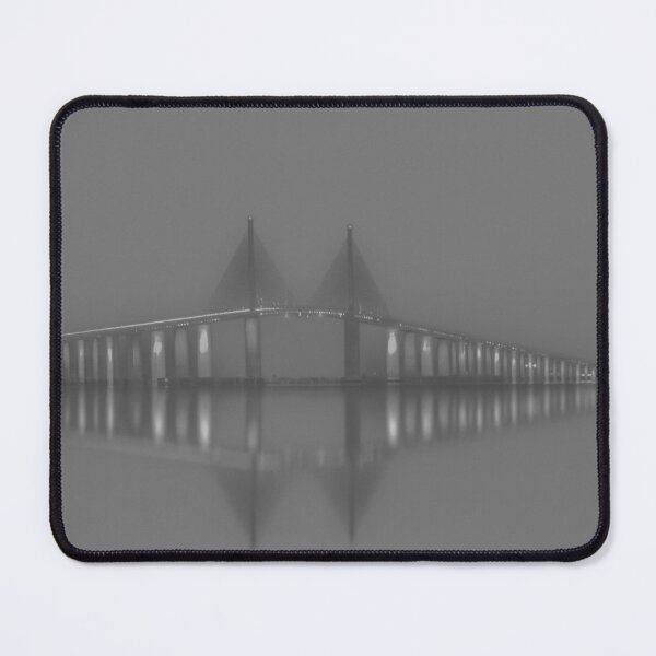 Item preview, The Sunshine Skyway Bridge glows at night in mono that reflect across the calm waters of Tampa Bay designed and sold by EyezWatchin.