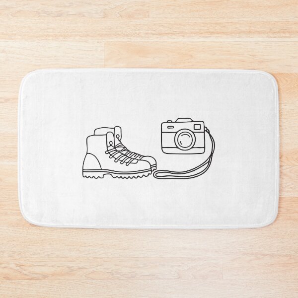 Item preview, A camera next to a pair of hiking boots, strap trailing on the ground   designed and sold by rasagamastore.