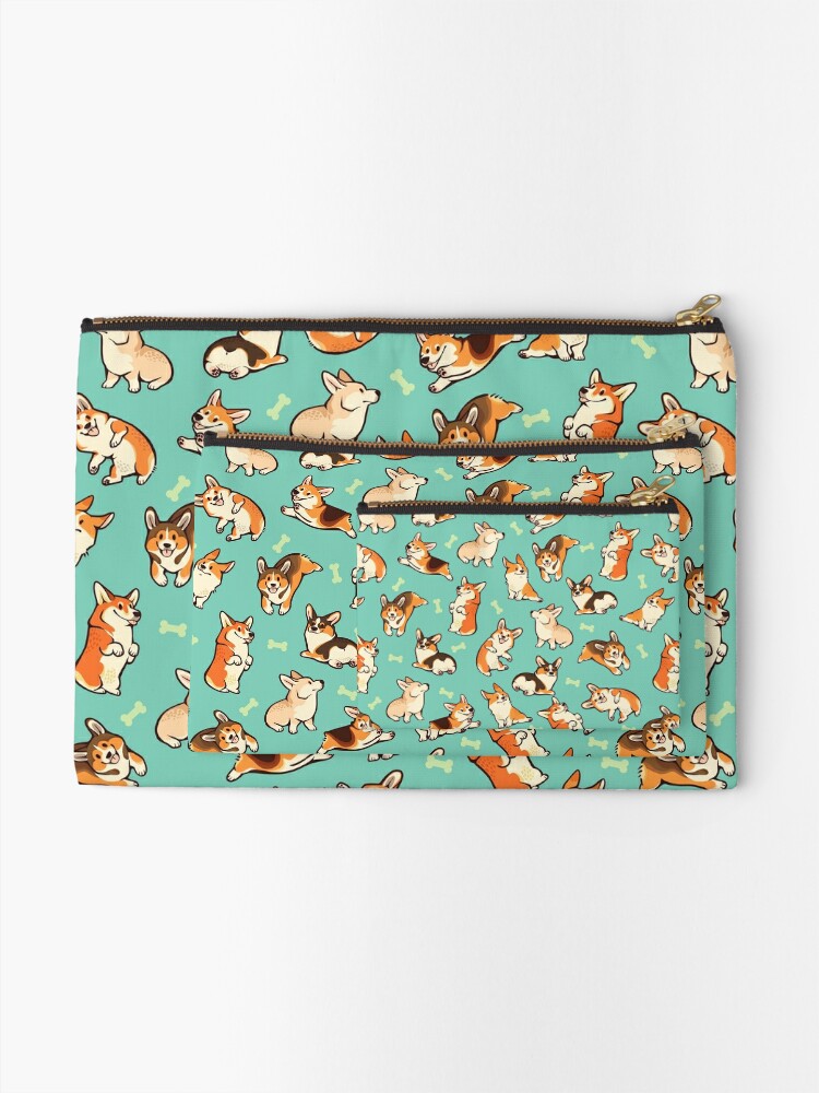 Jolly corgis in green Zipper Pouch for Sale by Colordrilos