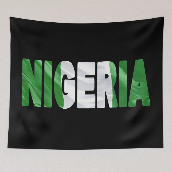 Item preview, NIGERIA - Flag Flying in Wind cut to Letters Souvenir Sticker Shirt T-Shirt designed and sold by Adam Gormley.