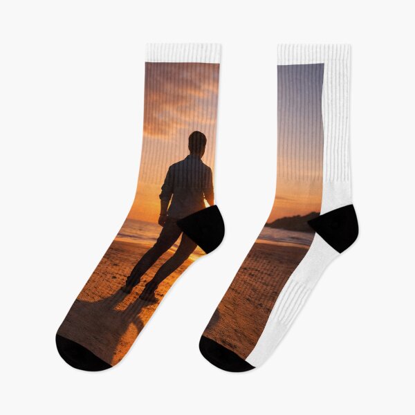 Item preview, A couple holding hands at sunset, their shadows forming a heart on the ground designed and sold by MagicMaker1984.