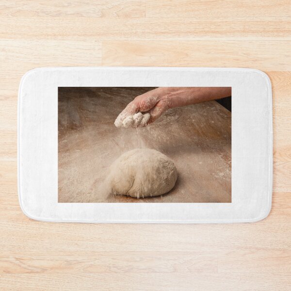 Item preview, Baker sprinkles flour on bread dough designed and sold by Ingo Gerlach.