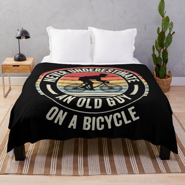 Item preview, Never Underestimate An Old Guy On A Bicycle designed and sold by heupelipocko.