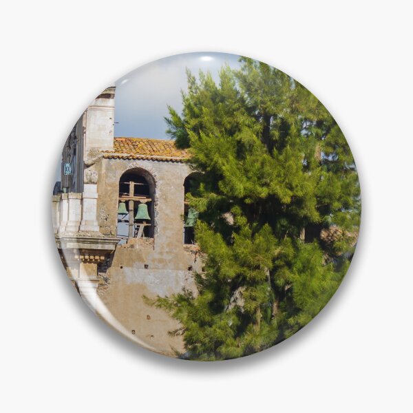 Item preview, Historic Stone Church Tower With Bells Overlooking Quiet Town Street and Green Tree Under Blue Sky designed and sold by Nmallia.