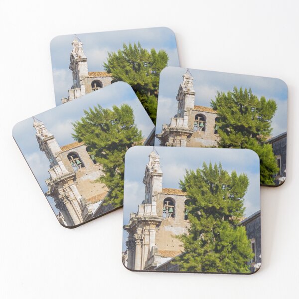 Item preview, Historic Stone Church Tower With Bells Overlooking Quiet Town Street and Green Tree Under Blue Sky designed and sold by Nmallia.