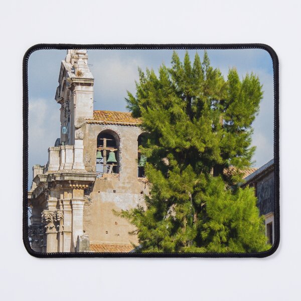 Item preview, Historic Stone Church Tower With Bells Overlooking Quiet Town Street and Green Tree Under Blue Sky designed and sold by Nmallia.