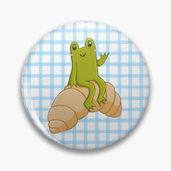Artikelvorschau, Frosch auf einem Croissant auf kariertem Grund entworfen und verkauft von Robiscuit.