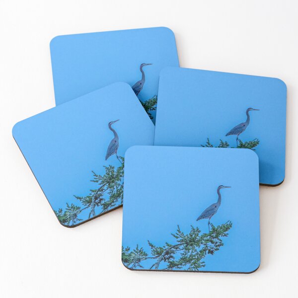 Item preview, Great Blue Heron perched on a treetop against blue evening sky designed and sold by lisavonbiela.