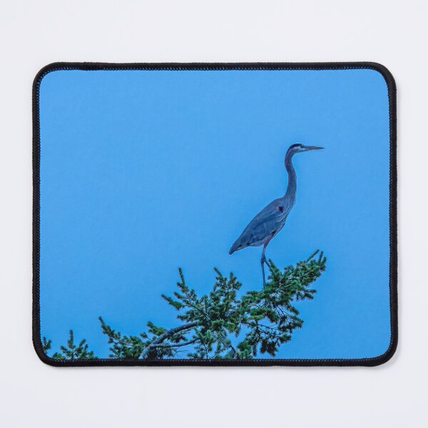 Item preview, Great Blue Heron perched on a treetop against blue evening sky designed and sold by lisavonbiela.