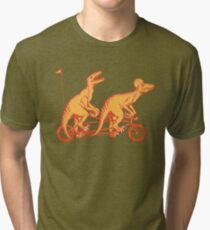Cycling raptors on tandem bicycle Tri-blend T-Shirt