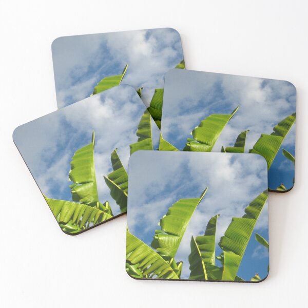 Item preview, Green Banana Fronds Waving in a Blue Sky with Fluffy Clouds designed and sold by JoyousArt4u.