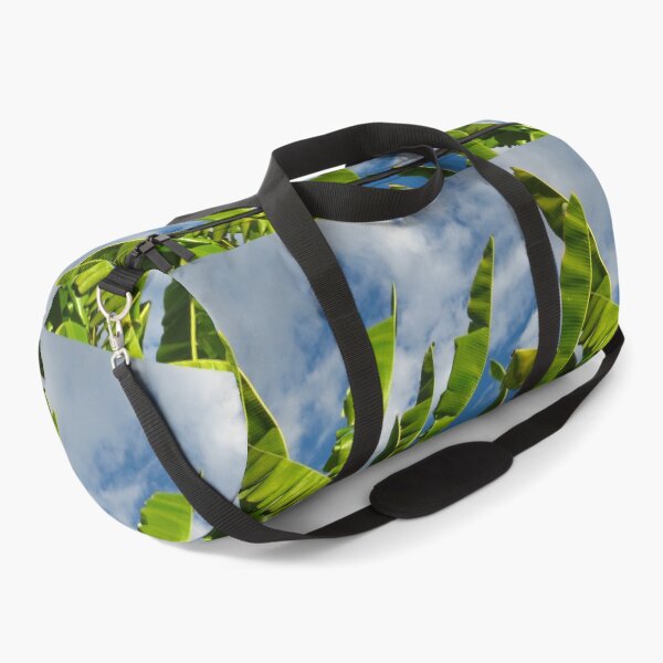 Item preview, Green Banana Fronds Waving in a Blue Sky with Fluffy Clouds designed and sold by JoyousArt4u.