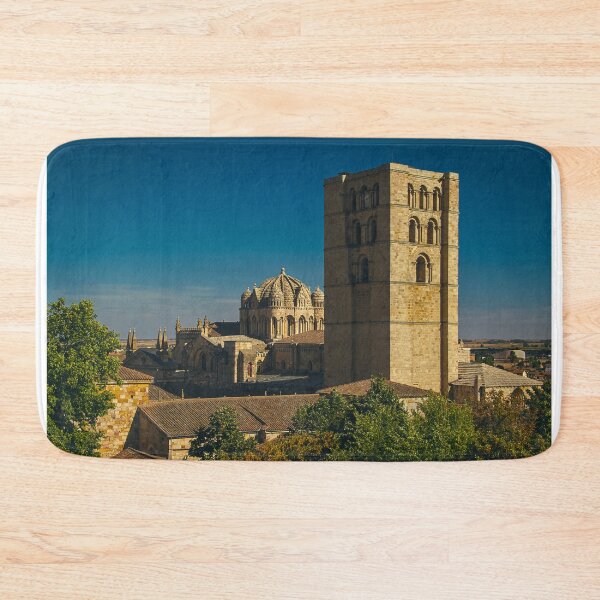 Item preview, Stone church tower of zamora cathedral viewed from jardines de baltasar lobo park in zamora designed and sold by DFLC Prints.