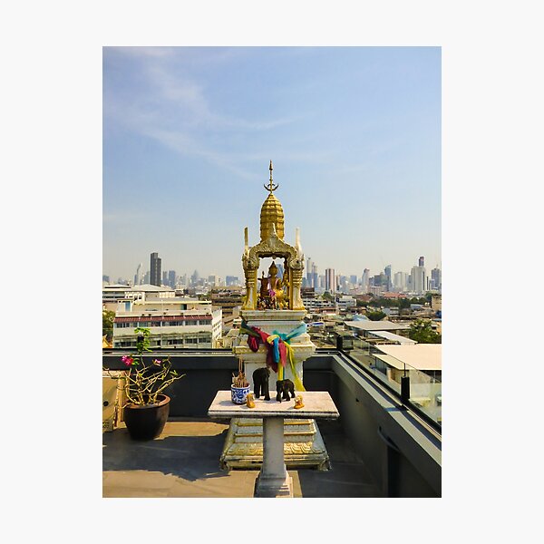 Spirit house and Bangkok's skyline Photographic Print