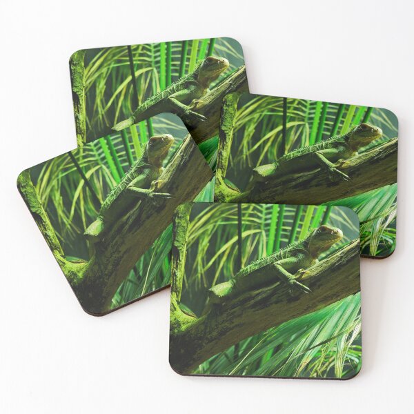 Item preview, Green Iguana resting on a branch in tropical foliage designed and sold by Makaronia.