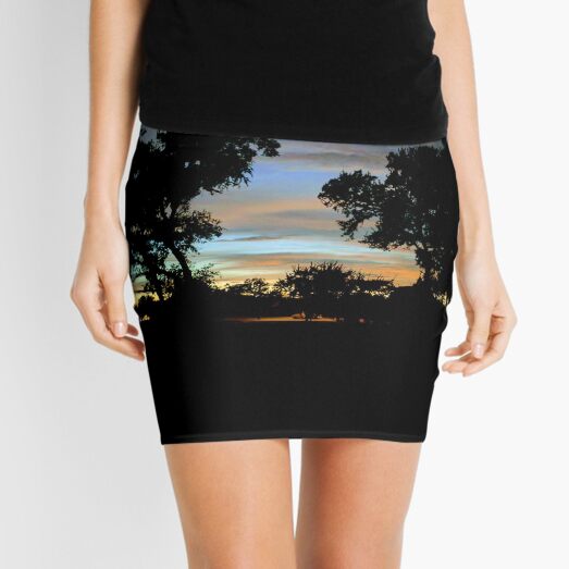 Twilight sunset with old trees Mini Skirt