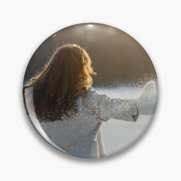 Item preview, A woman in a white coat walks on a frozen lake and enjoys the sun. designed and sold by ewawrona.