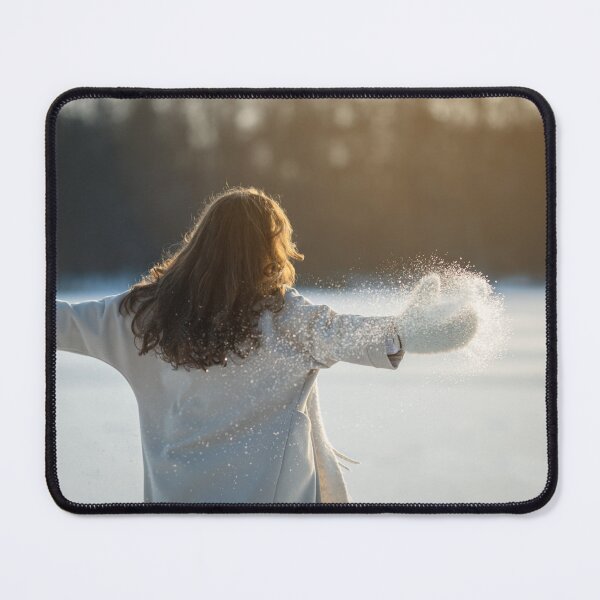 Item preview, A woman in a white coat walks on a frozen lake and enjoys the sun. designed and sold by ewawrona.