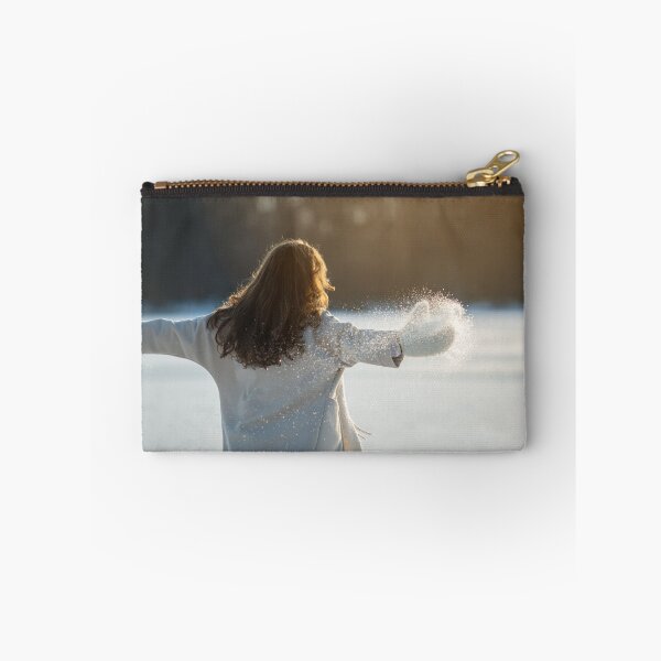 Item preview, A woman in a white coat walks on a frozen lake and enjoys the sun. designed and sold by ewawrona.