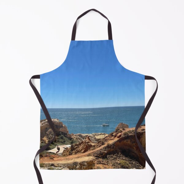 Item preview, Sailboat Between Golden Cliffs Over Deep Blue Ocean designed and sold by MatthewHeights.